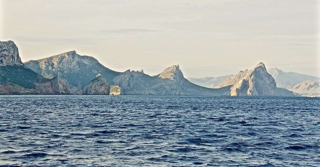 Rocky, mountainous north coast of Mallorca. Cruising Attitude Sailing Blog - Discovery 55