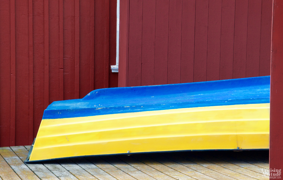 A rowboat in swedish colours; Mollösund, Sweden | Cruising Attitude Sailing Blog - Discovery 55