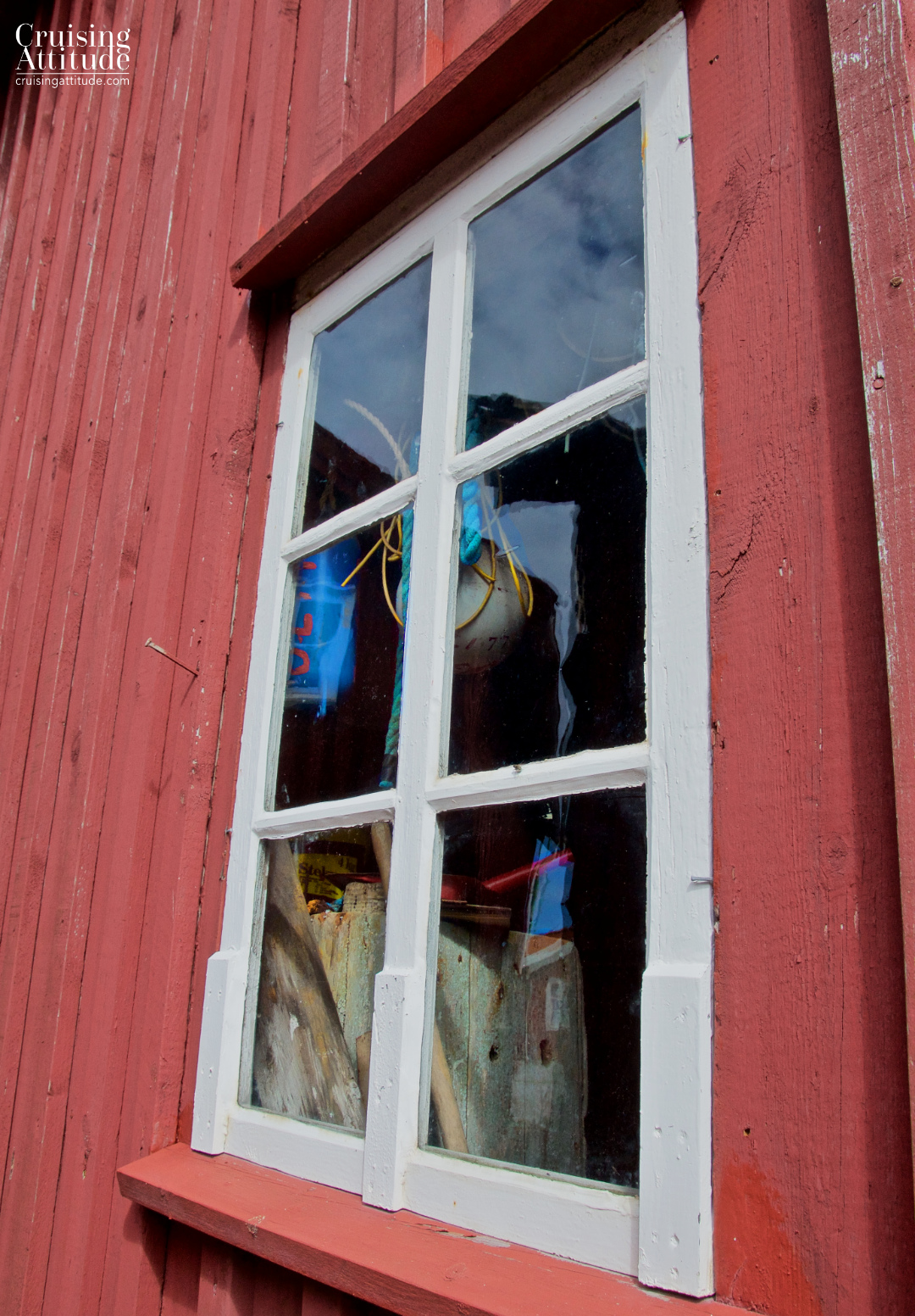 Looking into the window of a fishing cabin. Mollösund, Sweden | Cruising Attitude Sailing Blog - Discovery 55 